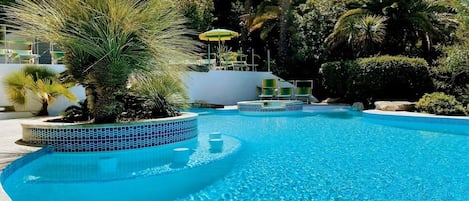 Seasonal outdoor pool, open 9:00 AM to 8:30 PM, pool umbrellas