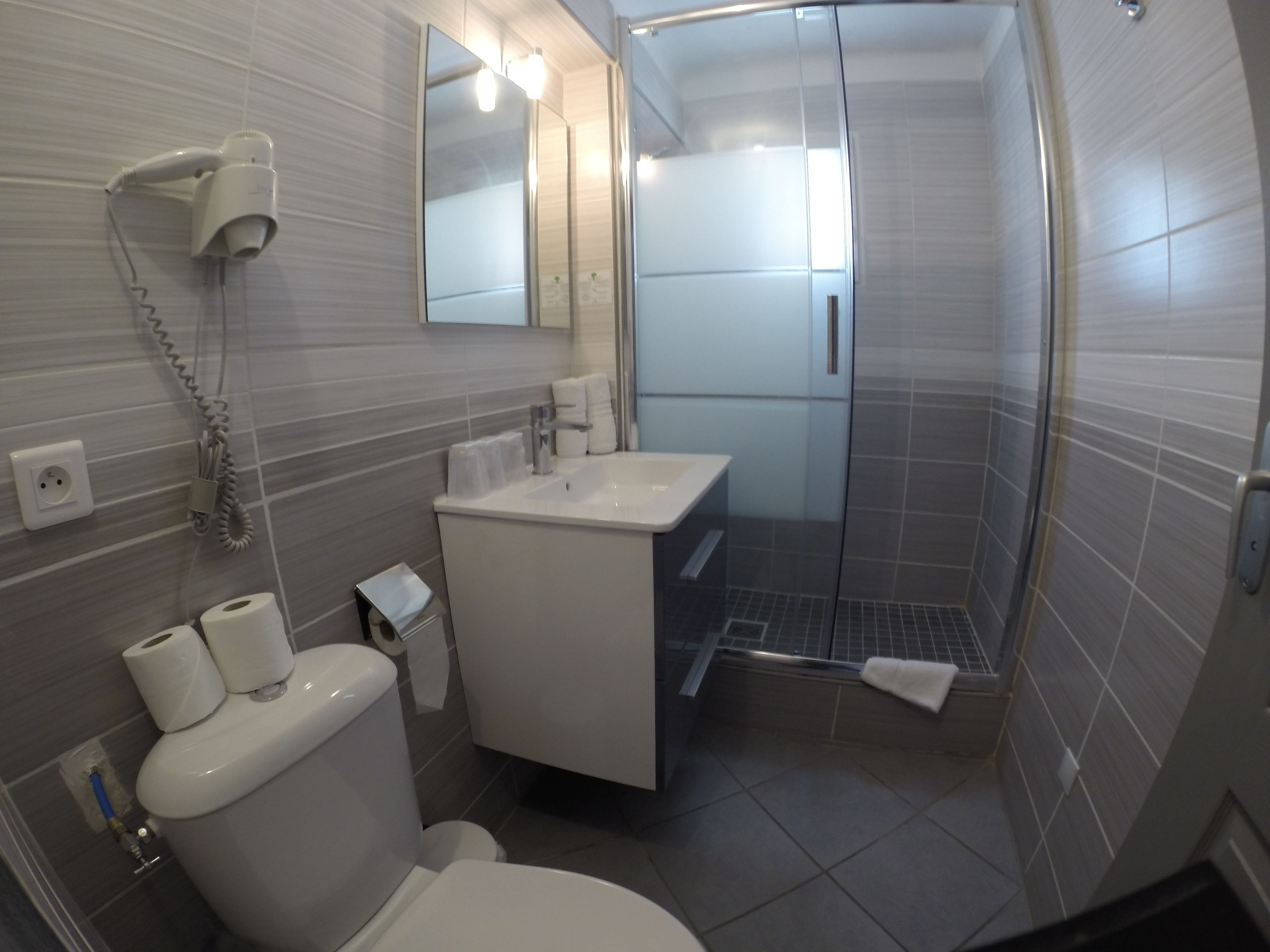 economy triple room | bathroom | hair dryer, towels