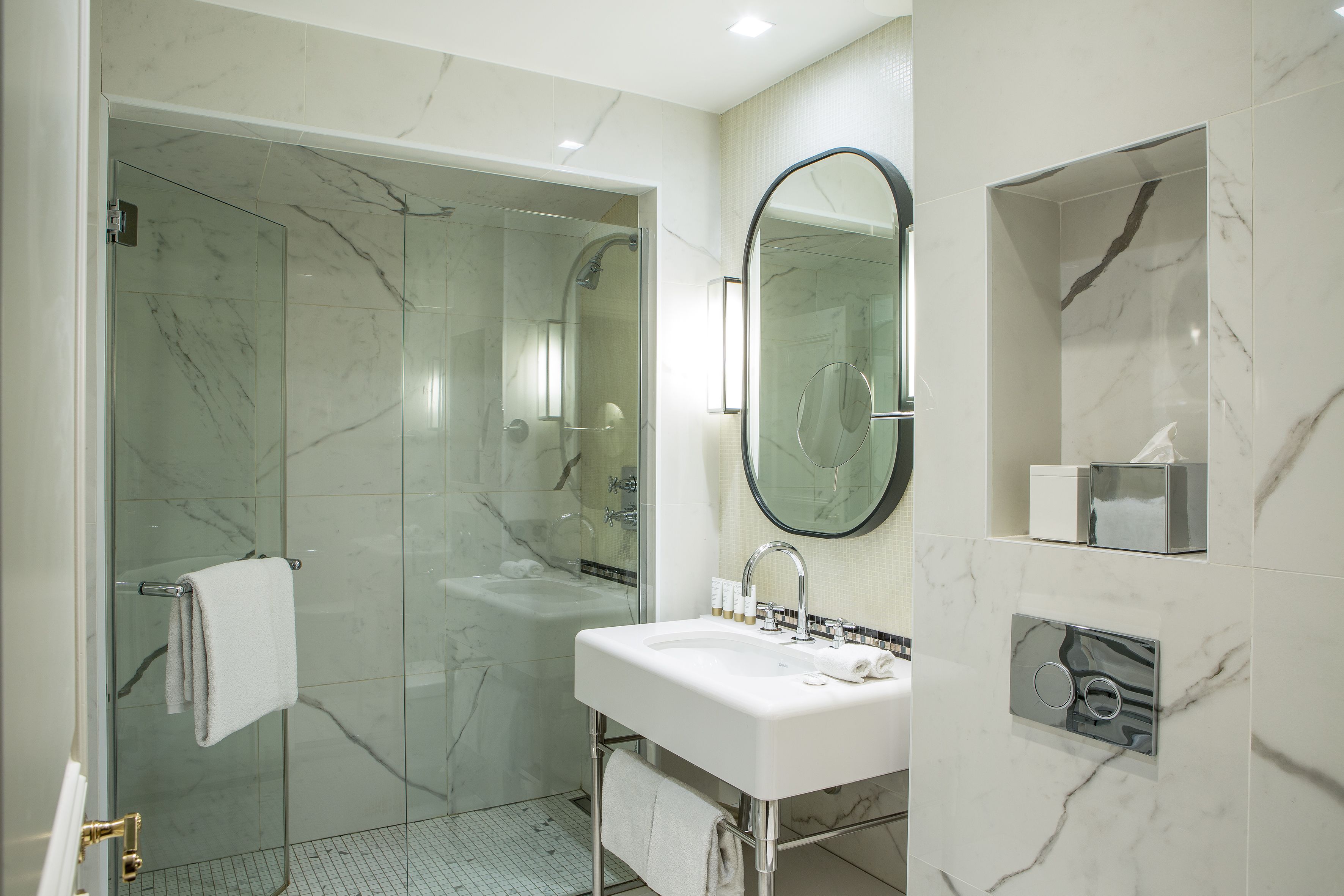 deluxe room | bathroom | shower, hair dryer, bathrobes, towels