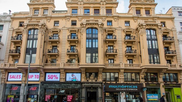 A historic building with ornate architecture, featuring multiple balconies and large windows. - Hostal The Good Rooms (Madrid)