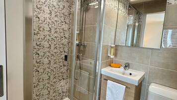 Shower, free toiletries, hair dryer, towels