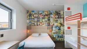 A compact hotel room with a single bed, a desk, and a bunk bed. - hotelF1 Reims Tinqueux (Tinqueux)