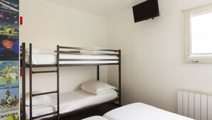 A bunk bed room with a white mattress, a wall-mounted TV, and a window with blinds. - hotelF1 Reims Tinqueux (Tinqueux)