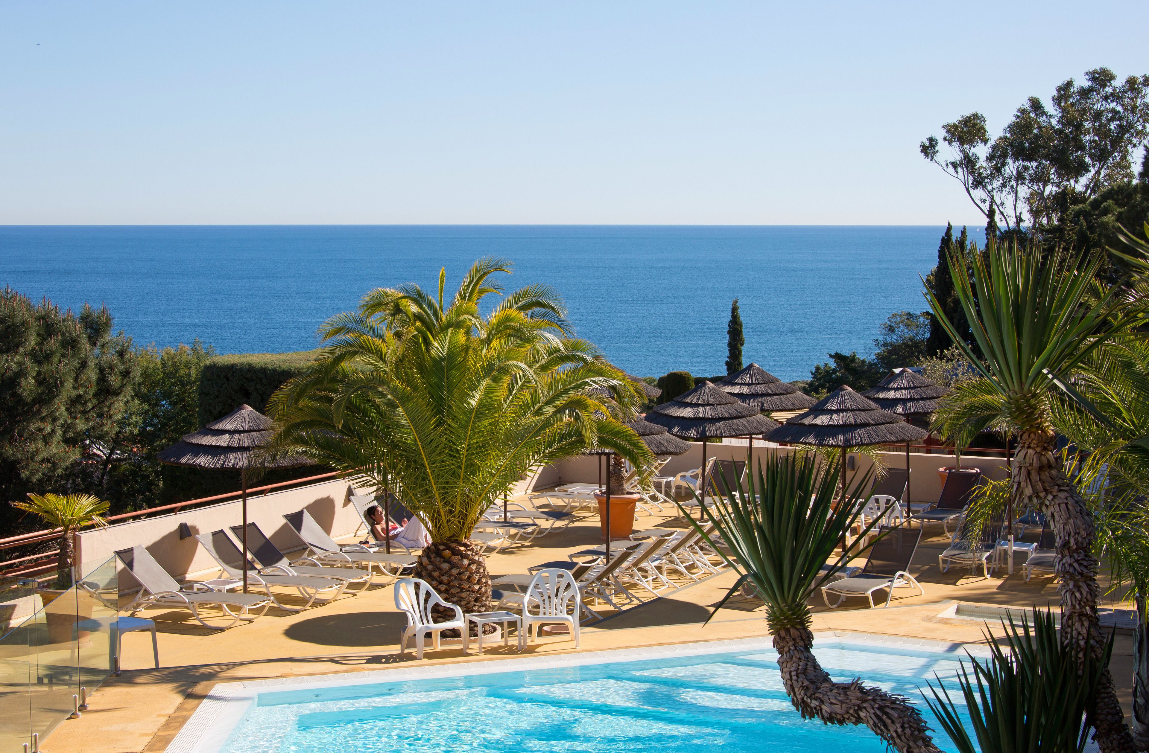 outdoor pool, pool umbrellas, pool loungers