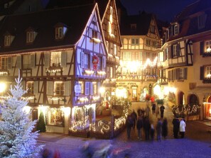 A traditional European building with a steeply pitched roof, multiple windows, and a sign that reads "vicer pigeon". - FastHôtel Colmar Houssen (Houssen)