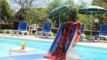 Outdoor pool, open 10:00 AM to 8:00 PM, free pool cabanas