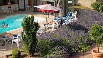 Outdoor pool, open 10:00 AM to 8:00 PM, free pool cabanas