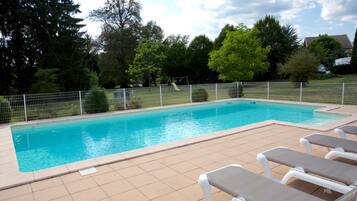 Seasonal outdoor pool, open 9 AM to 9 PM, pool loungers