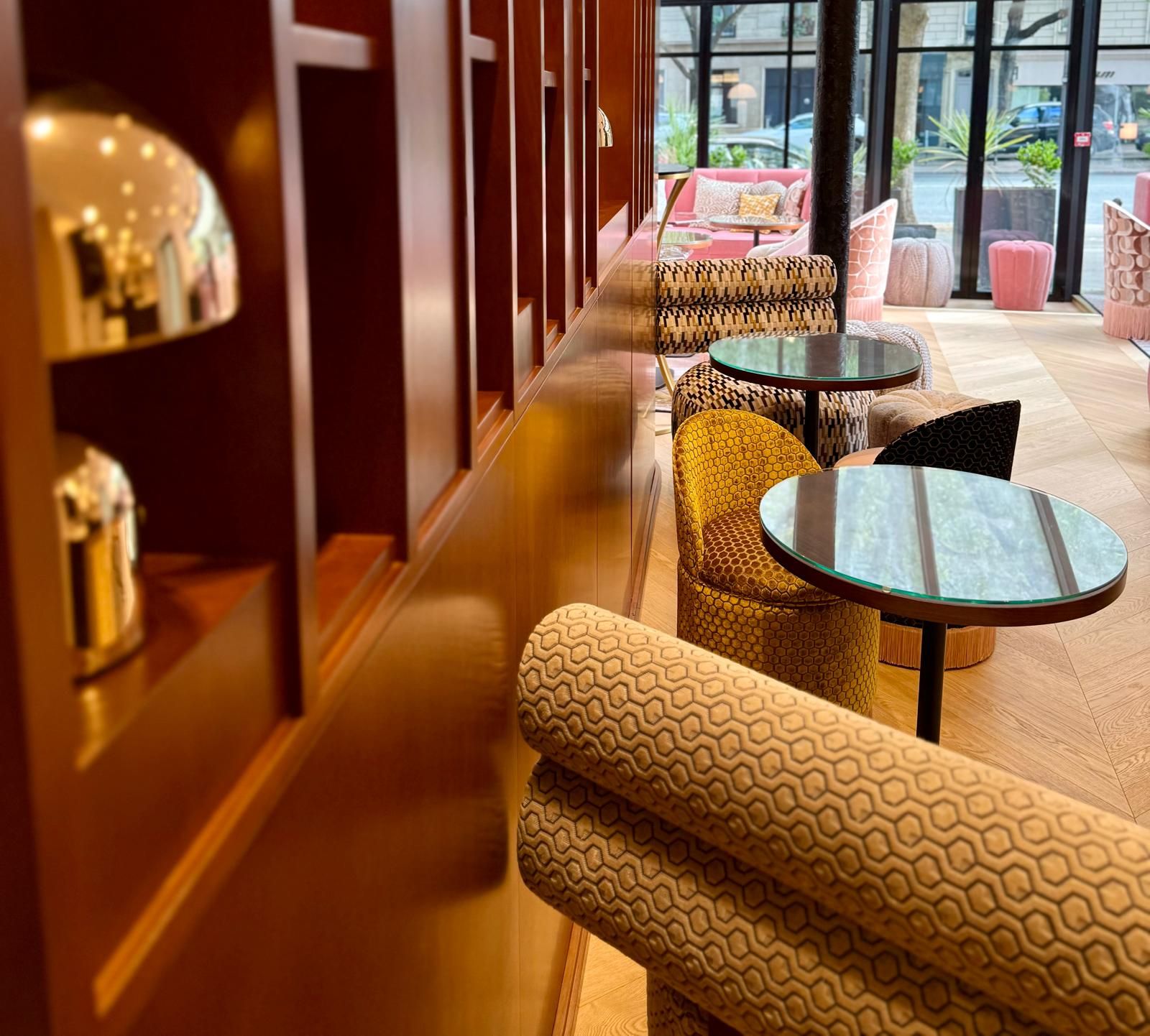 A modern interior with seating arrangements and a glass table.