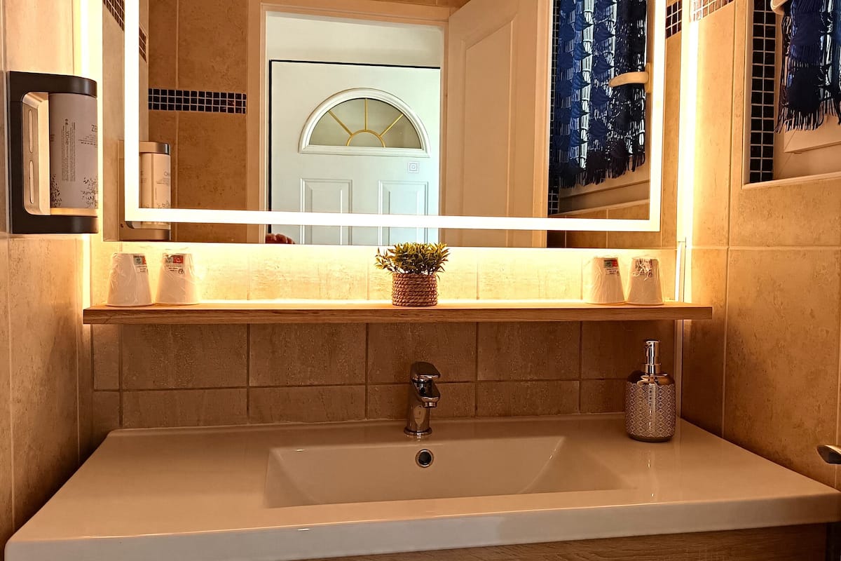 family suite, garden view | bathroom | shower, free toiletries, hair dryer, soap