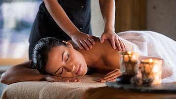 Experience a rejuvenating massage in a serene spa setting, complete with a soothing ambiance.