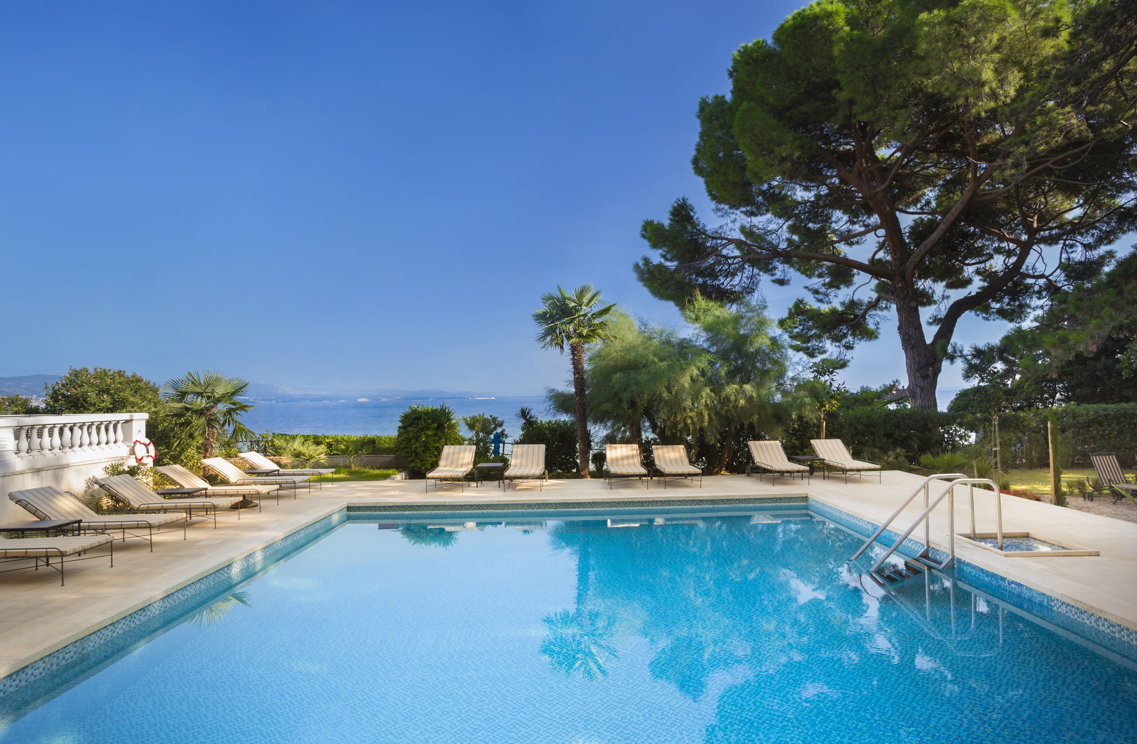 seasonal outdoor pool, open 8:00 am to 8:00 pm, pool umbrellas