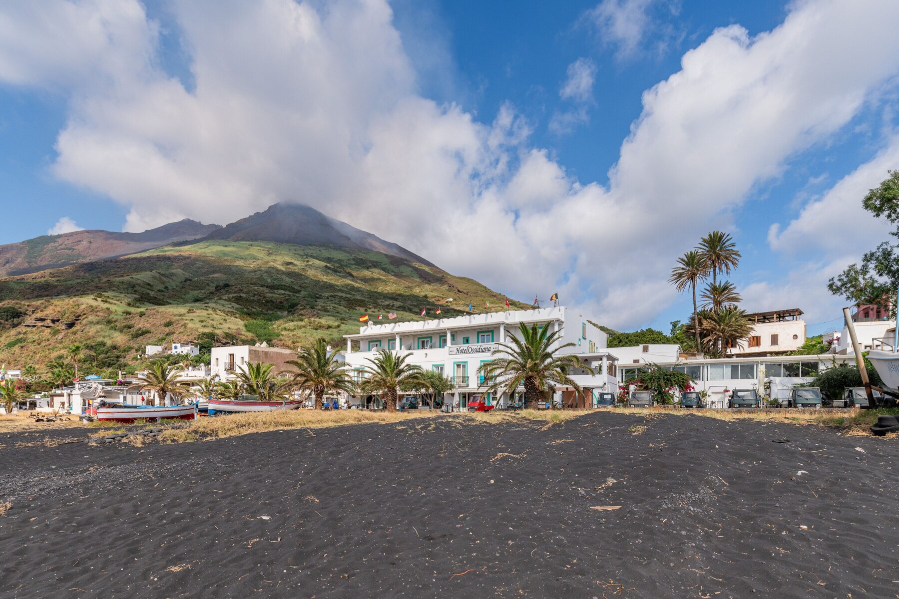 On the beach, black sand