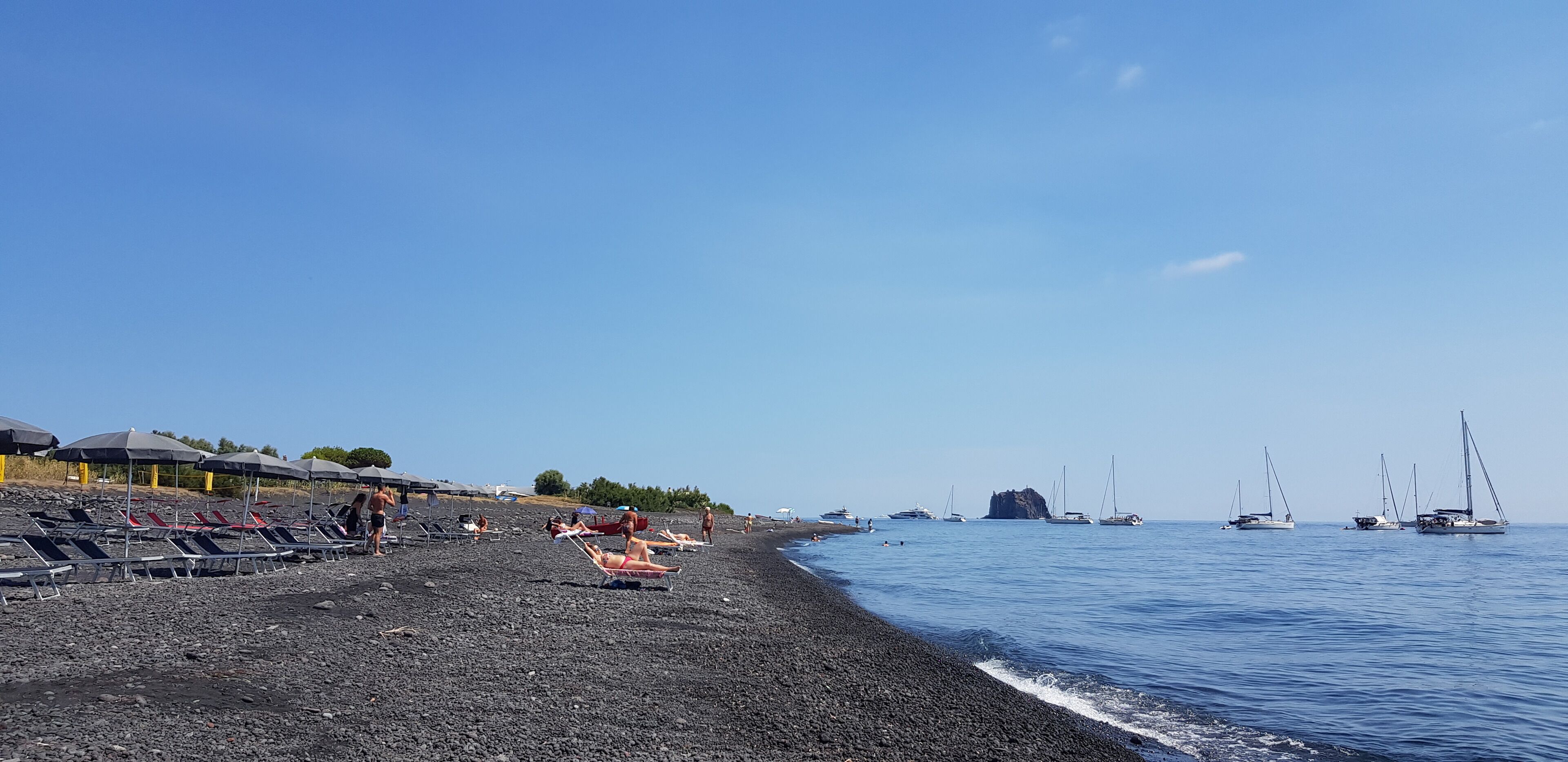 On the beach, black sand