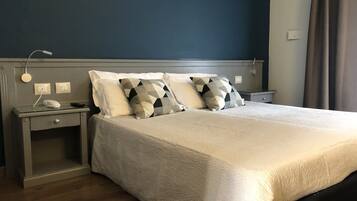 Economy Double Room | 1 bedroom, minibar, desk, blackout drapes