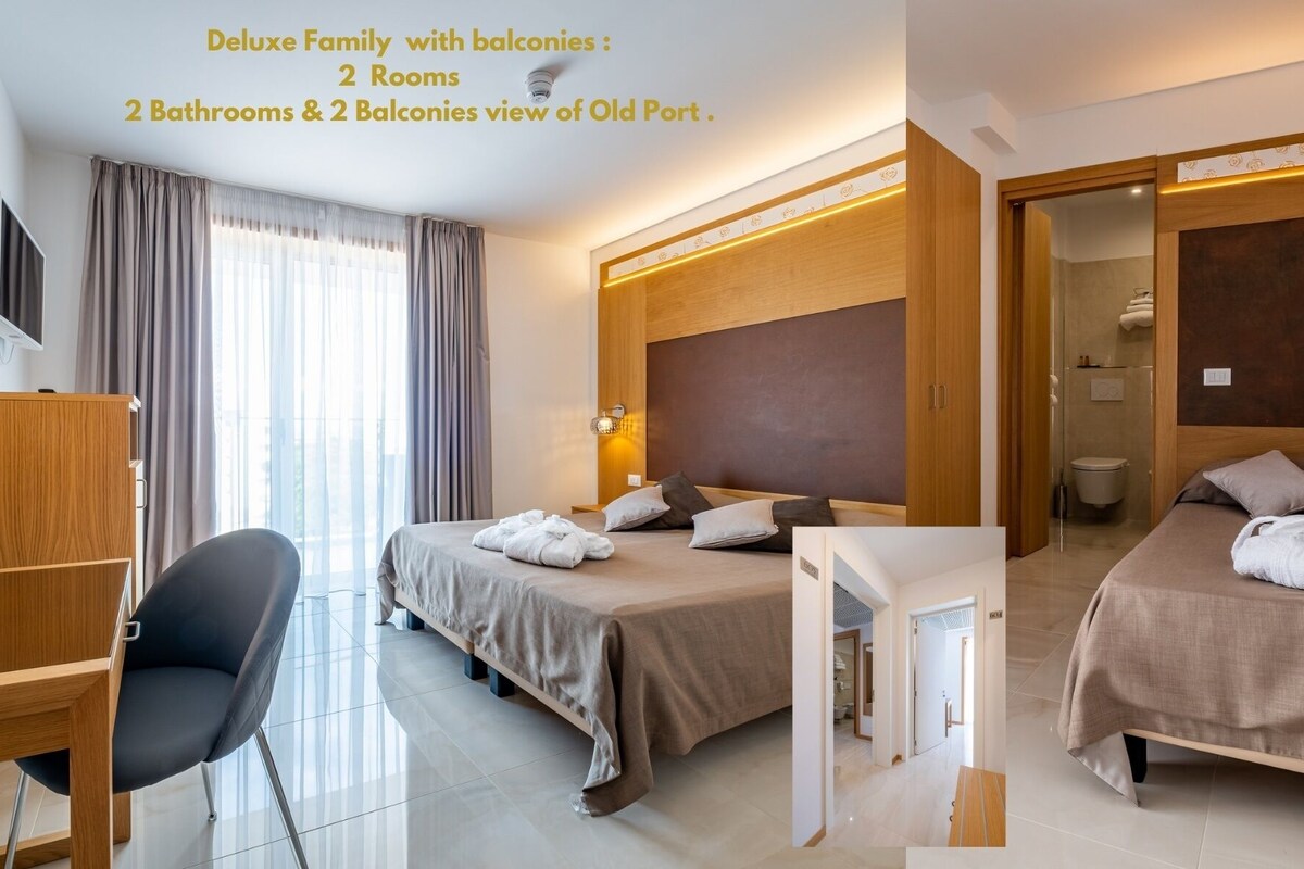 A deluxe family room with two bedrooms, two bathrooms, and balconies with a view of Old Port.