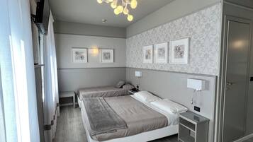 Triple Room | Frette Italian sheets, minibar, in-room safe, desk