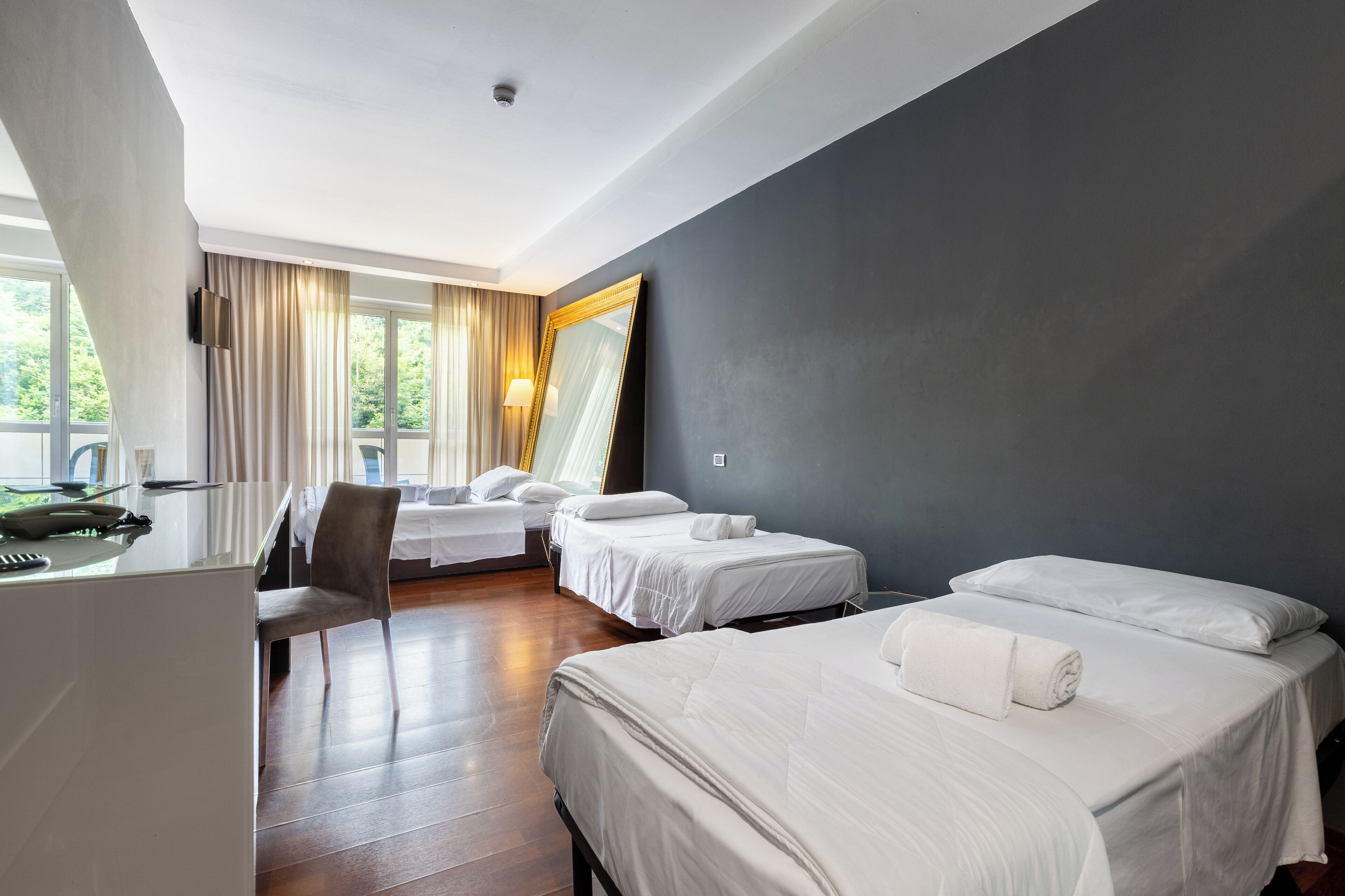 quadruple room | premium bedding, down duvets, memory-foam beds, minibar