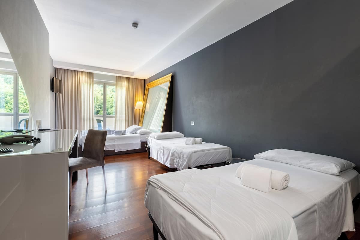 quadruple room | premium bedding, down duvets, memory-foam beds, minibar