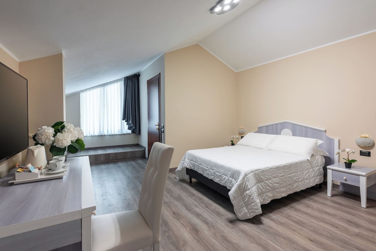 pillow-top beds, desk, laptop workspace, blackout curtains