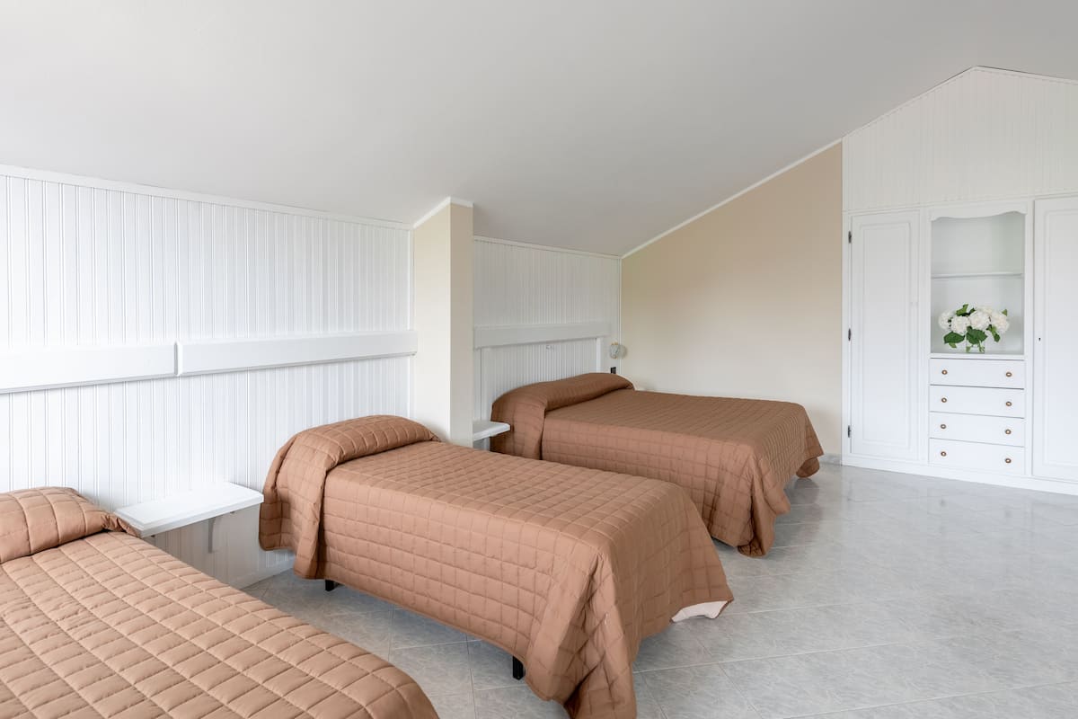 Quadruple Room | 1 bedroom, pillowtop beds, desk, laptop workspace