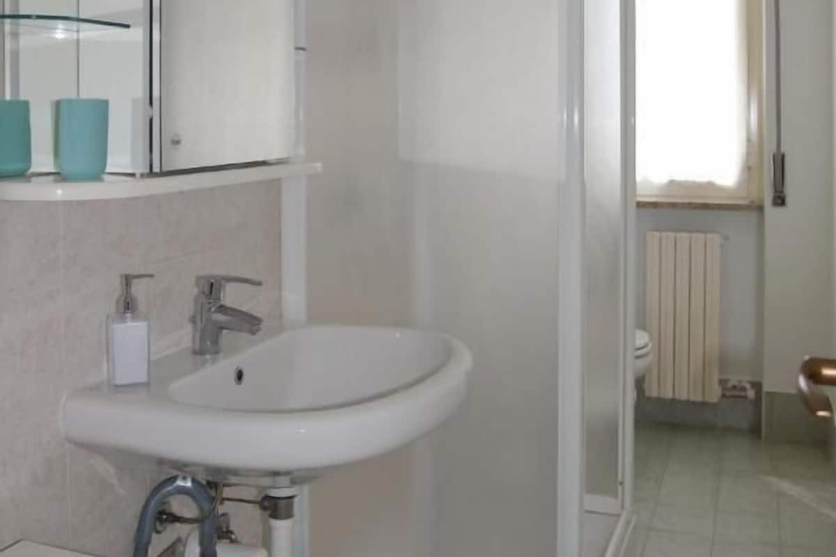 Shower, bathrobes, slippers, bidet