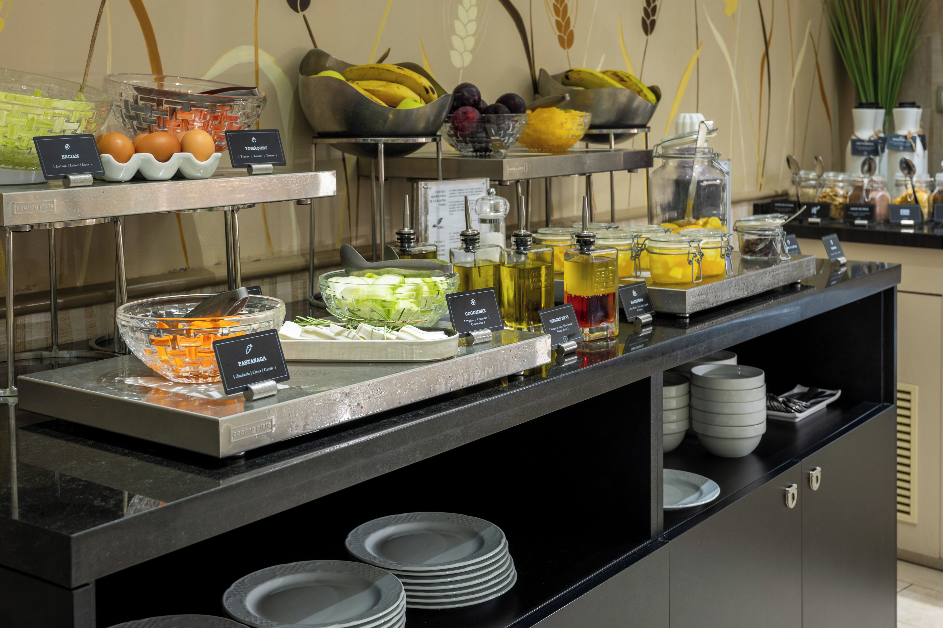 A buffet with various food items and condiments.