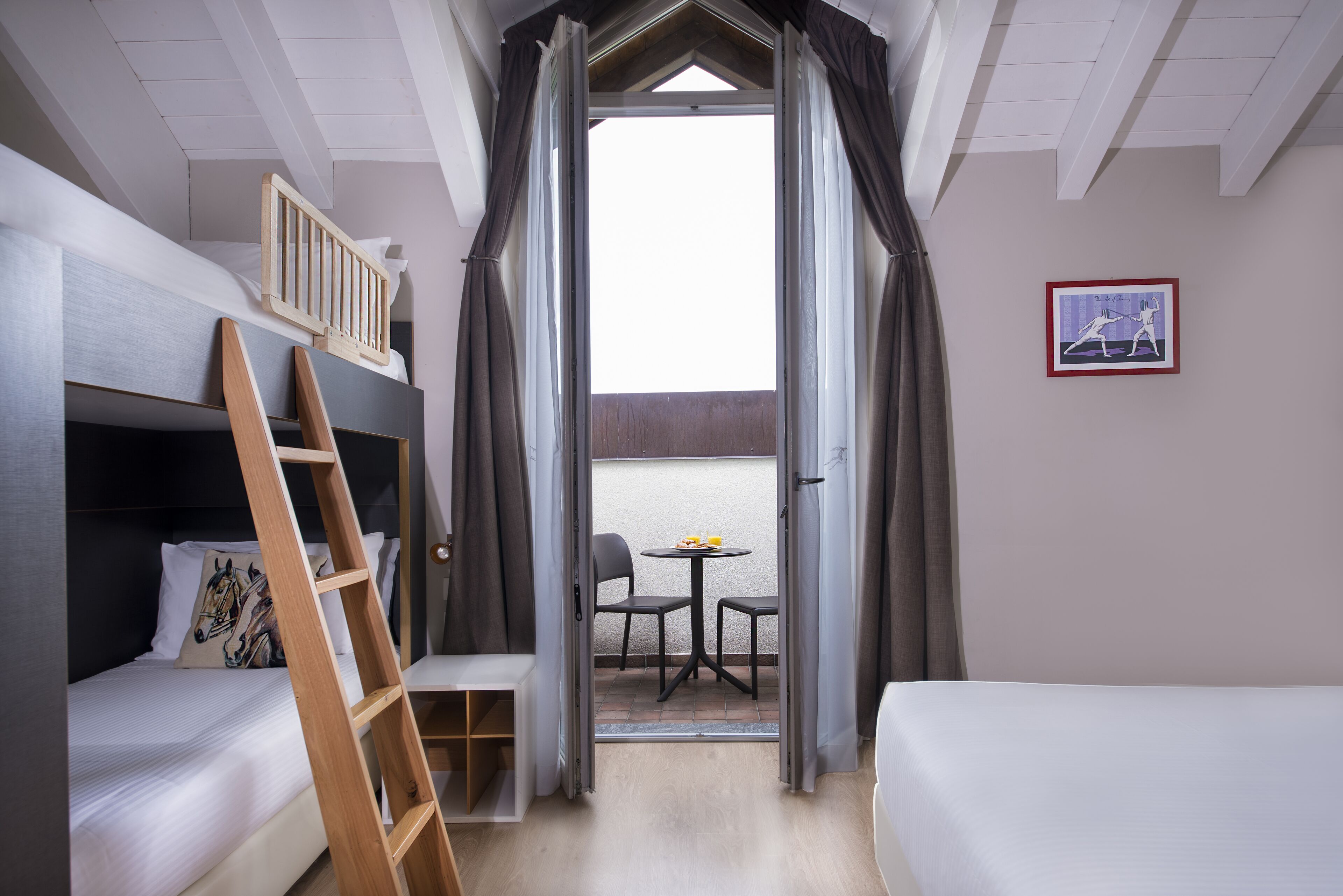 quadruple room | pillow-top beds, minibar, in-room safe, desk