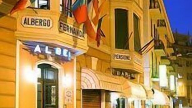 A street view of a building with the name 'ALBERGO' and 'FERNANDE' visible on the facade. - Hotel Fernanda (Rapallo)