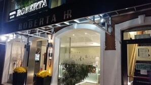 The exterior of Hotel Roberto with a modern design, featuring a glass entrance and a signboard. - Hotel Roberta (Mestre)