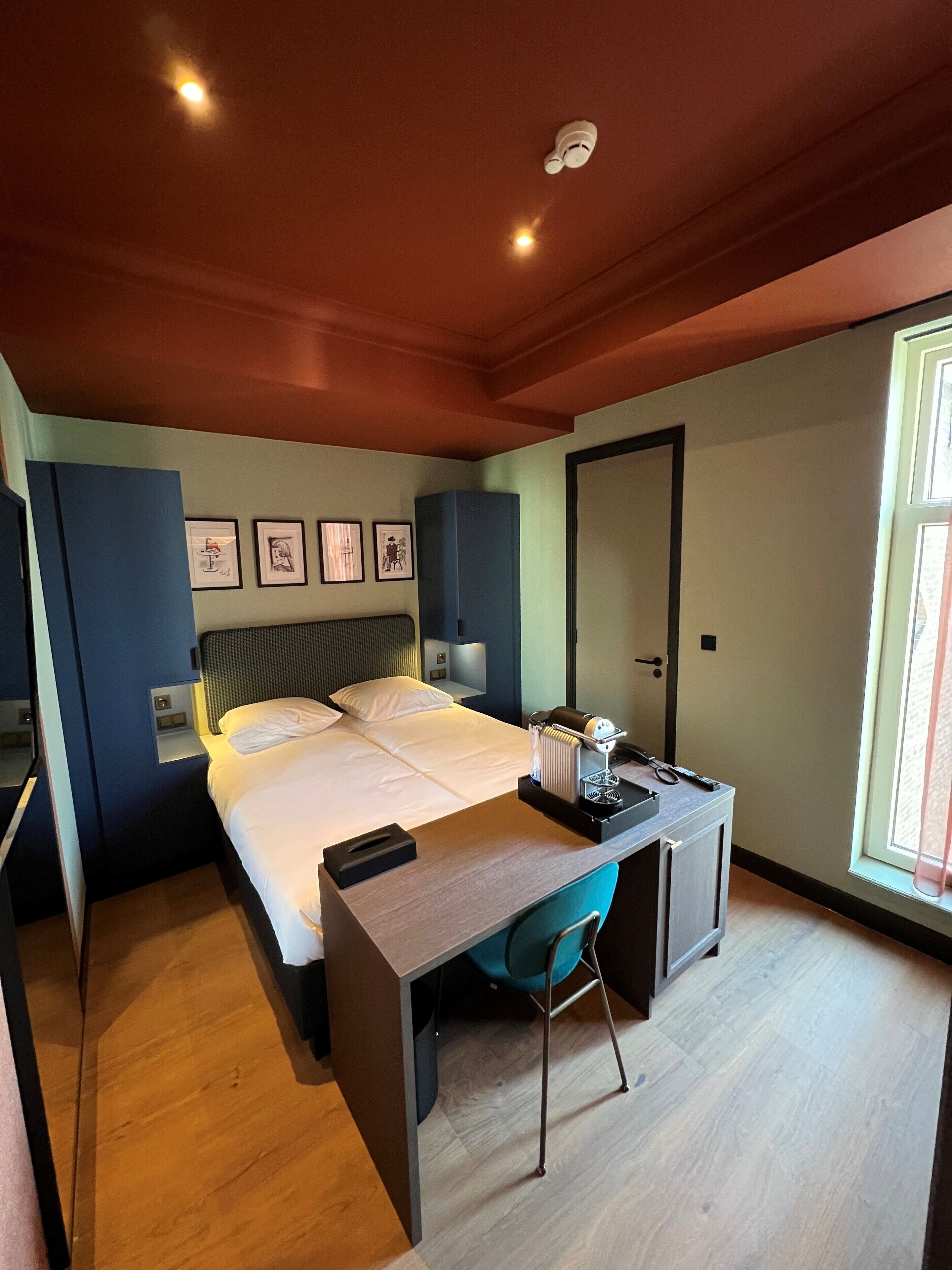 quadruple room, multiple beds | in-room safe, desk, blackout curtains, iron/ironing board