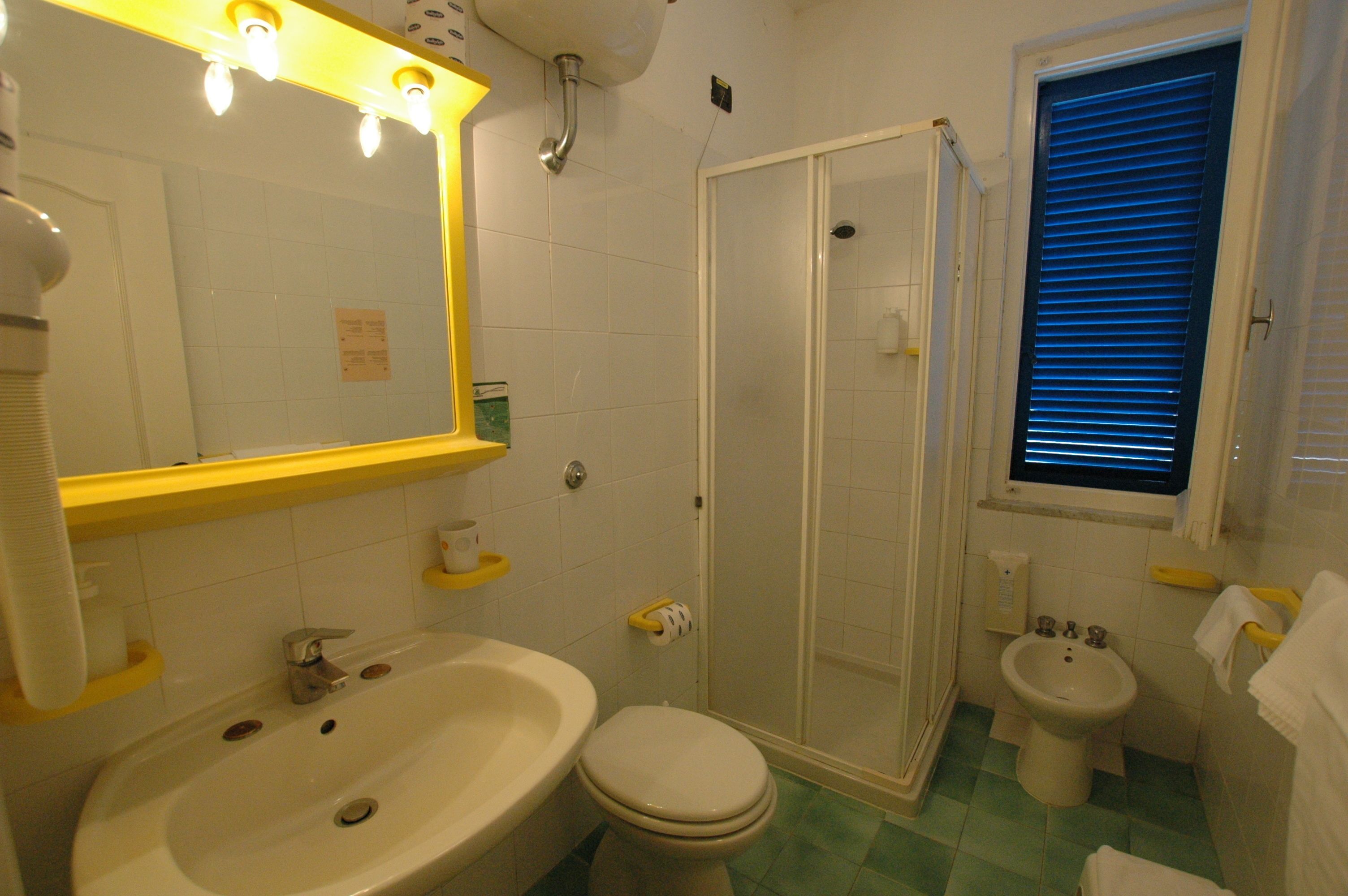 standard double or twin room | bathroom | shower, hair dryer, bidet, towels