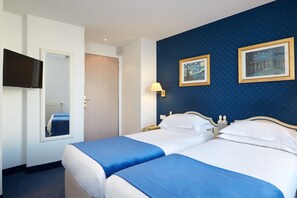In-room safe, desk, laptop workspace, blackout drapes - Austin's Saint Lazare Hotel (Paris)
