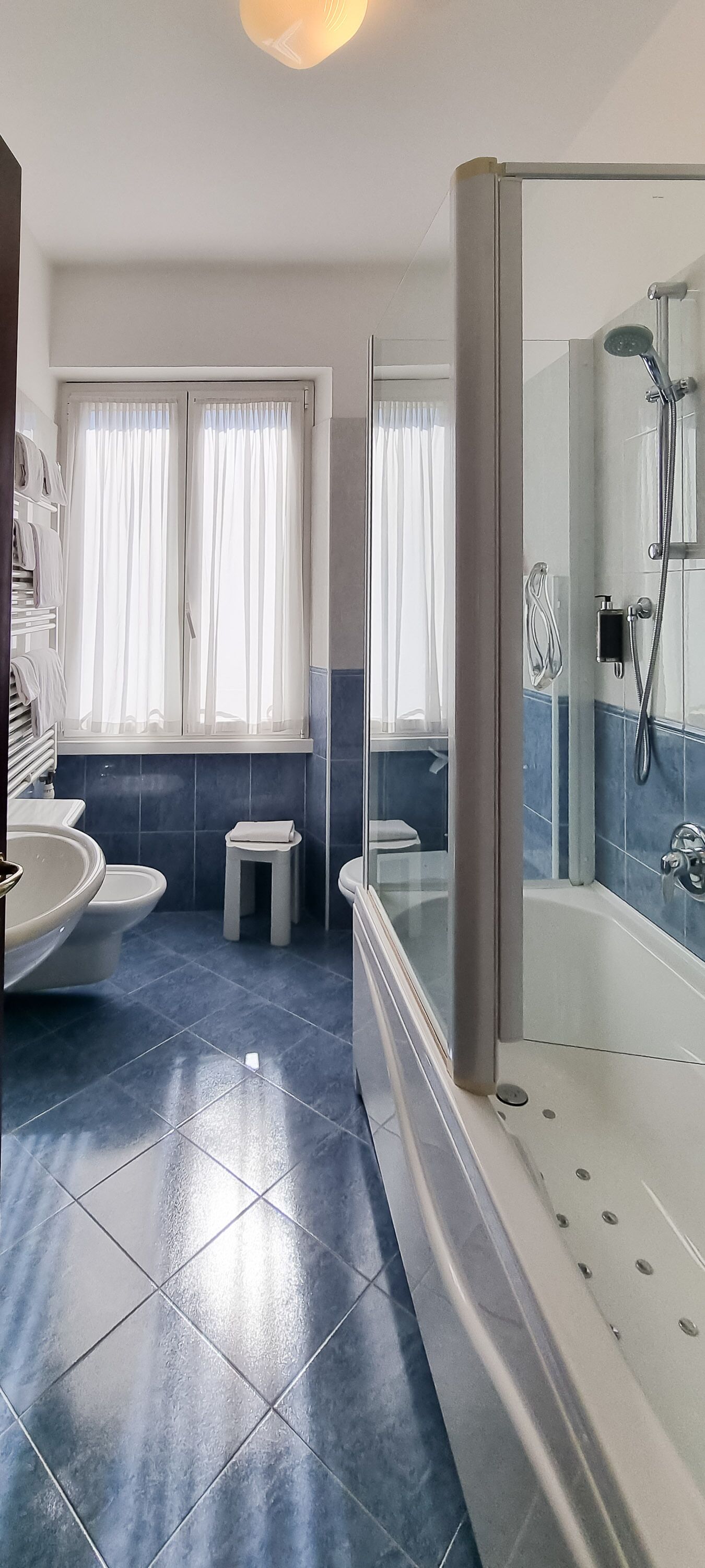double room, 1 large single bed | bathroom | shower, hair dryer, slippers, bidet