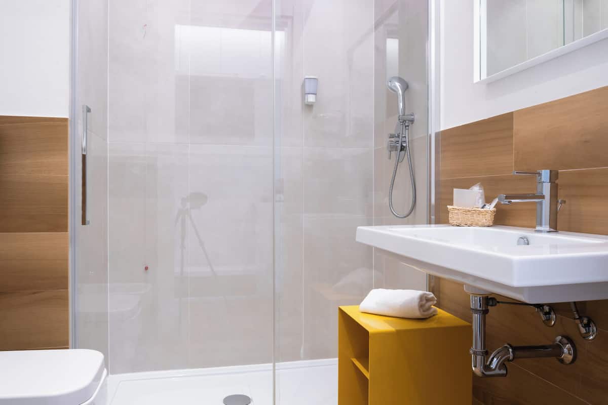 superior triple room | bathroom | shower, rainfall showerhead, free toiletries, slippers