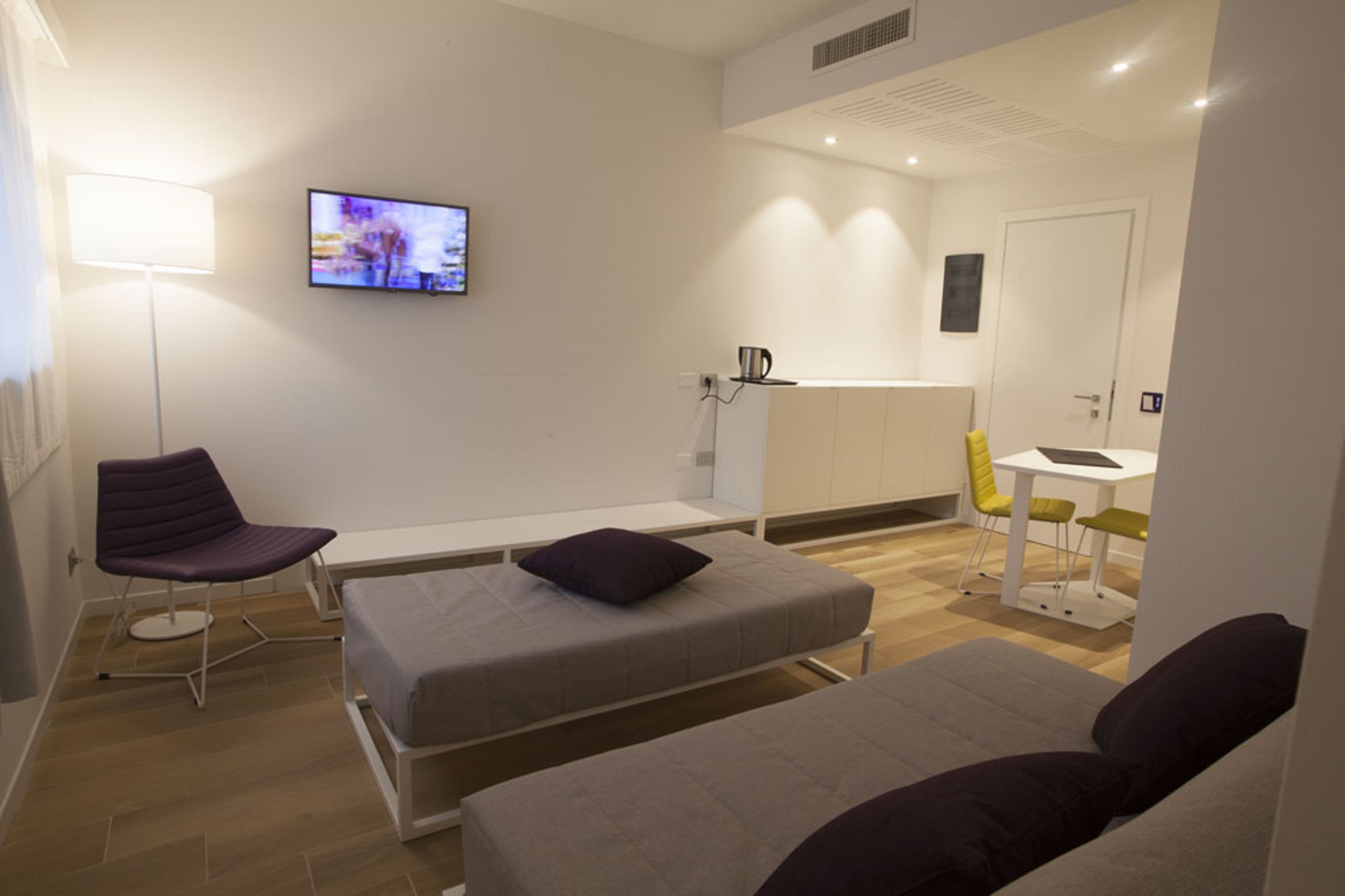 design suite, 1 double bed with sofa bed, accessible | living area | 32-inch led tv with satellite channels, tv, first-run films