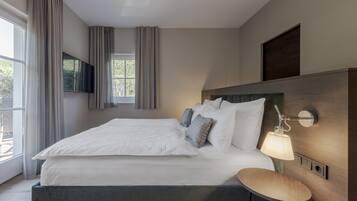Ropa de cama de alta calidad, minibar, caja fuerte y escritorio