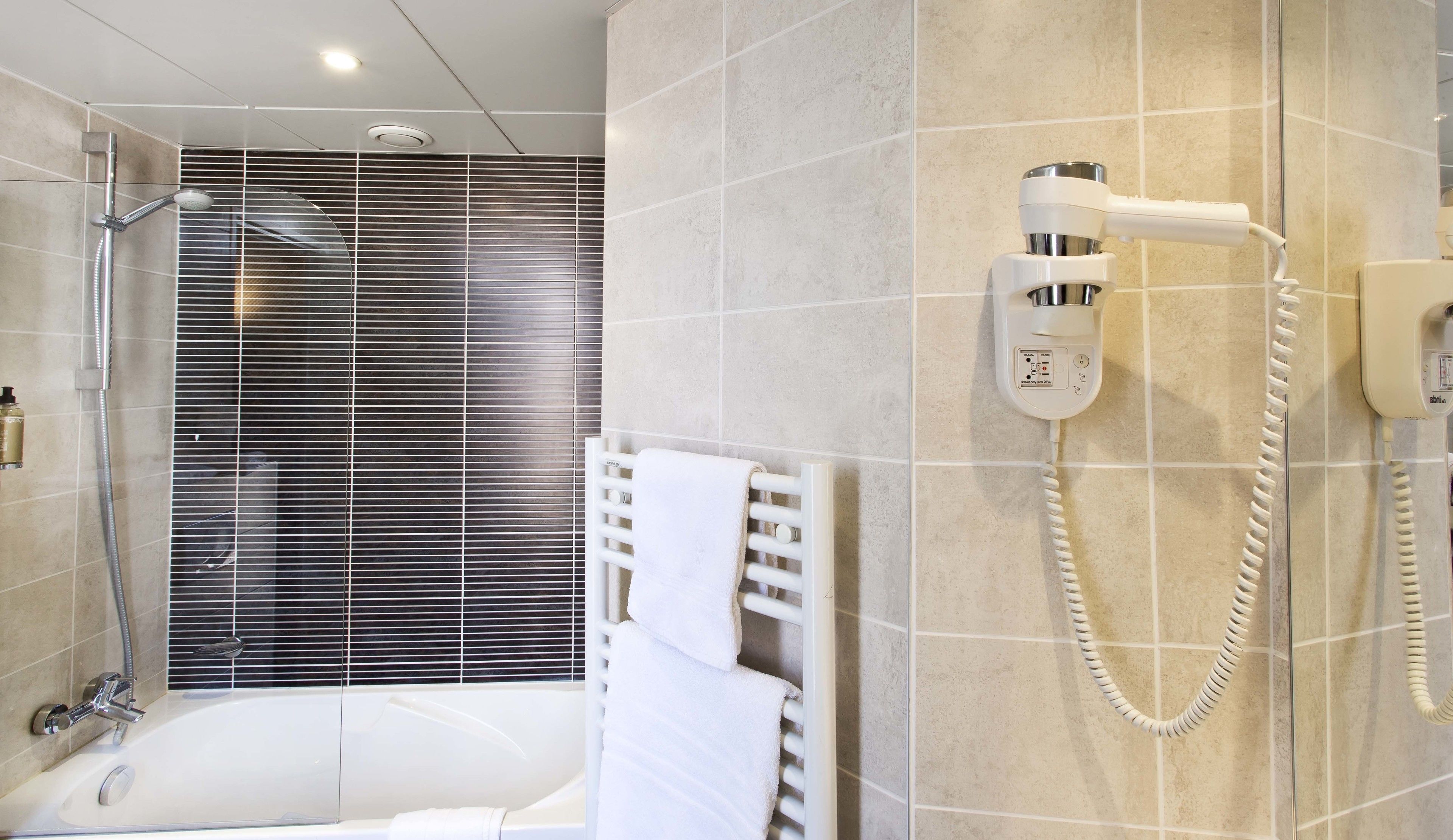 superior twin room | bathroom | free toiletries, hair dryer, towels, soap