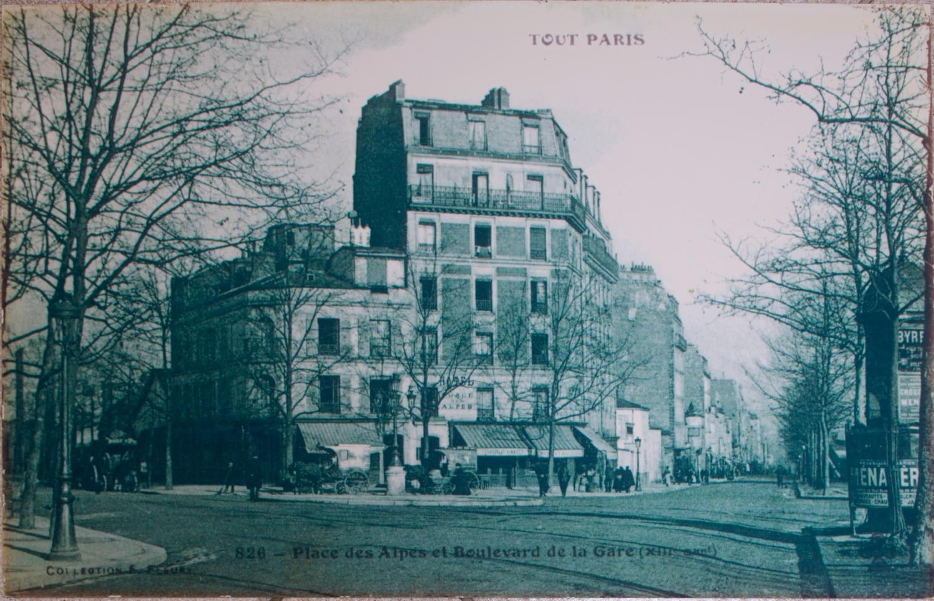 A historic building with multiple stories, large windows, and a prominent balcony.