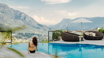 Indoor pool, seasonal outdoor pool, pool umbrellas, pool loungers