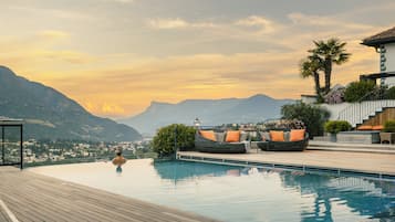 Indoor pool, seasonal outdoor pool, pool umbrellas, pool loungers