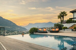 Indoor pool, seasonal outdoor pool, pool umbrellas, pool loungers