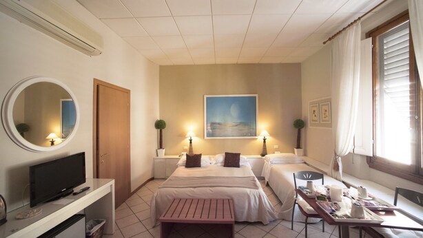 Triple Room | Minibar, in-room safe, desk, iron/ironing board (on request) - Residenza Manzoni (Florence)