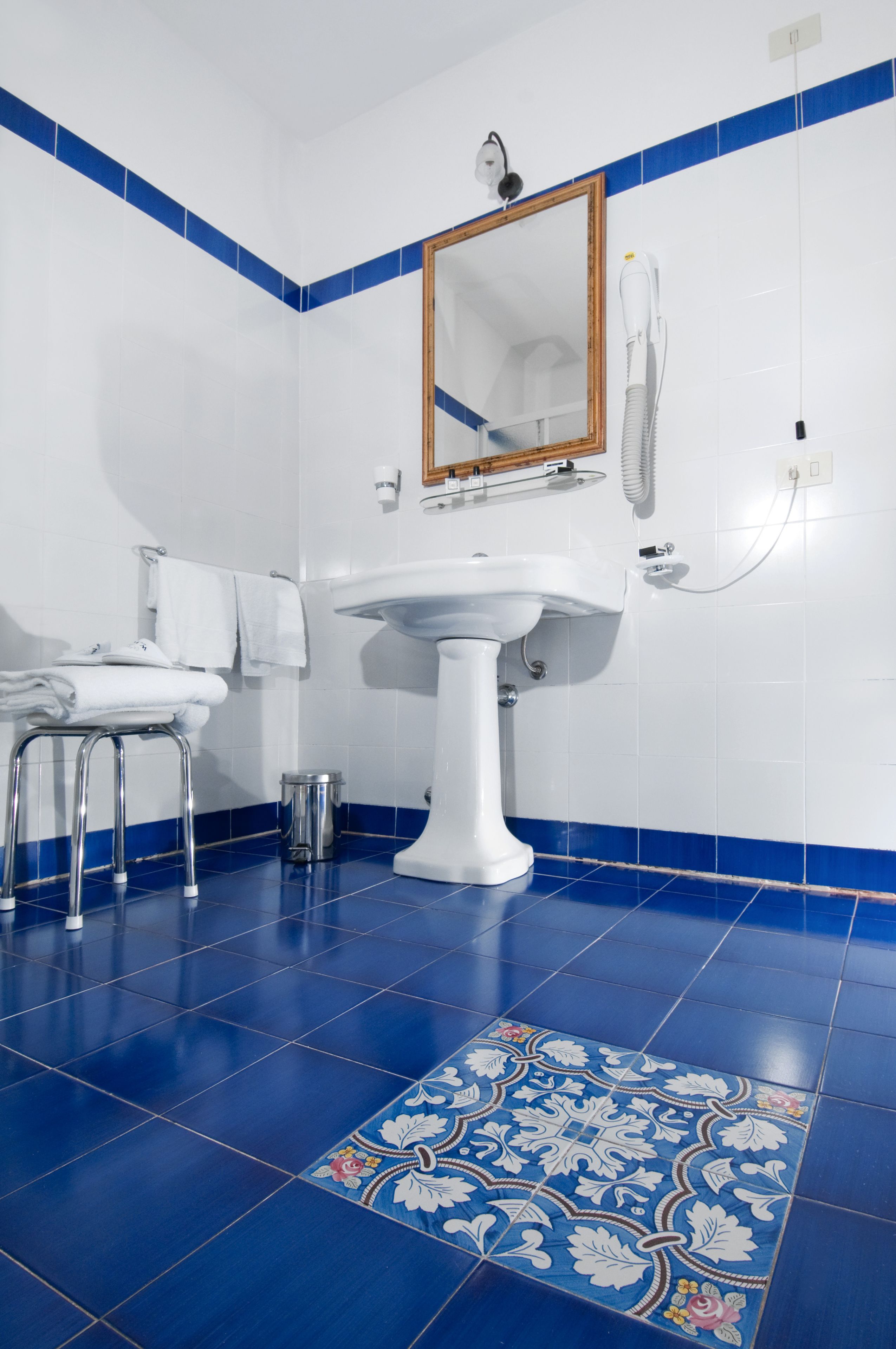 shower, designer toiletries, hair dryer, slippers