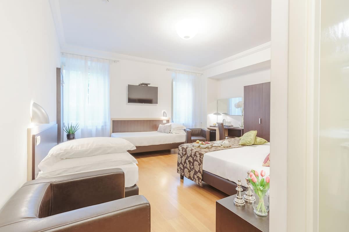 quadruple room | select comfort beds, minibar, in-room safe, desk