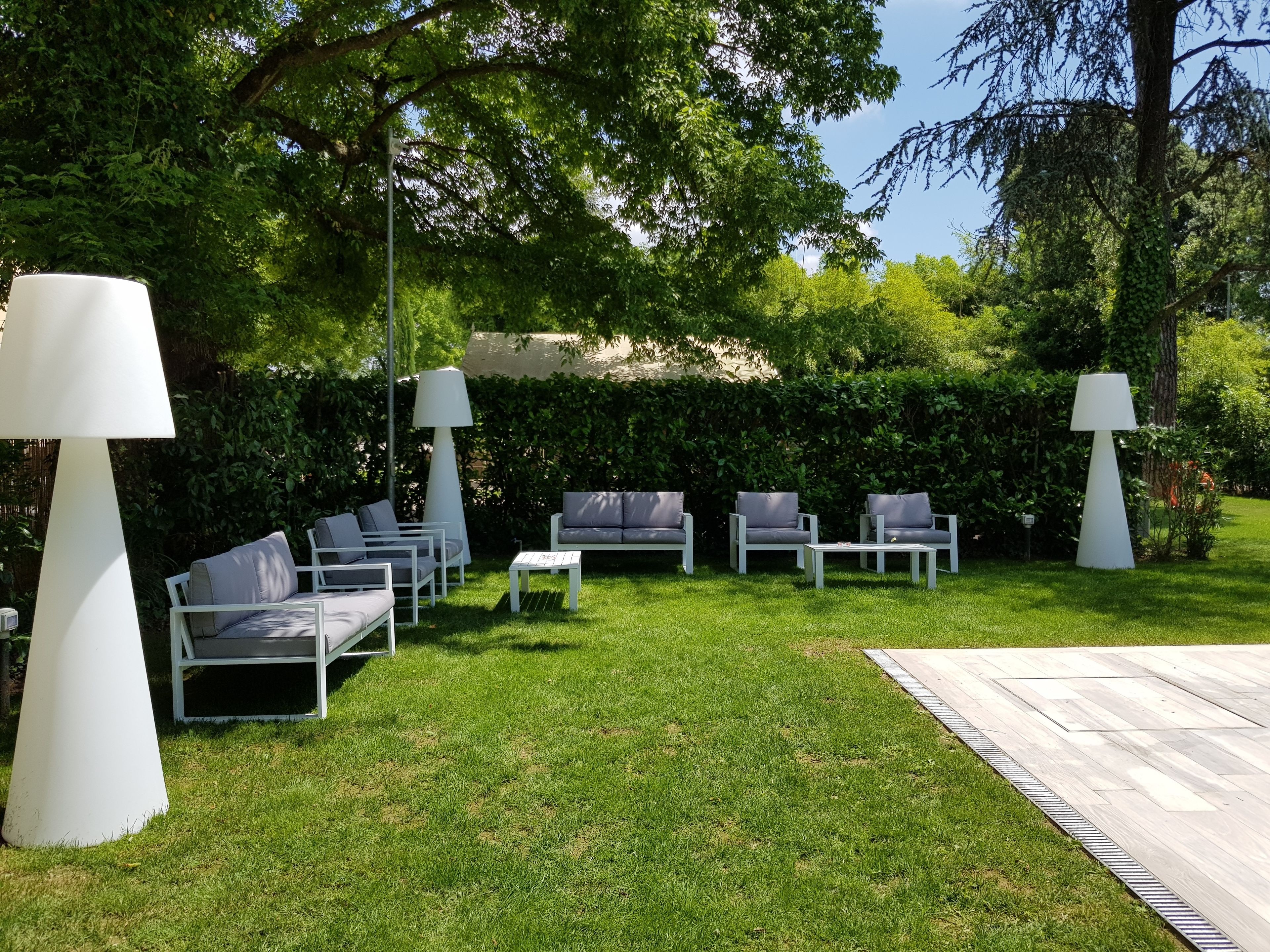 seasonal outdoor pool, an infinity pool, pool umbrellas, pool loungers