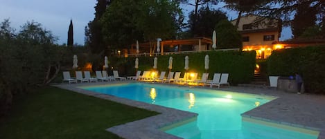 Outdoor pool, open 9:00 AM to 8:00 PM, pool umbrellas, pool loungers