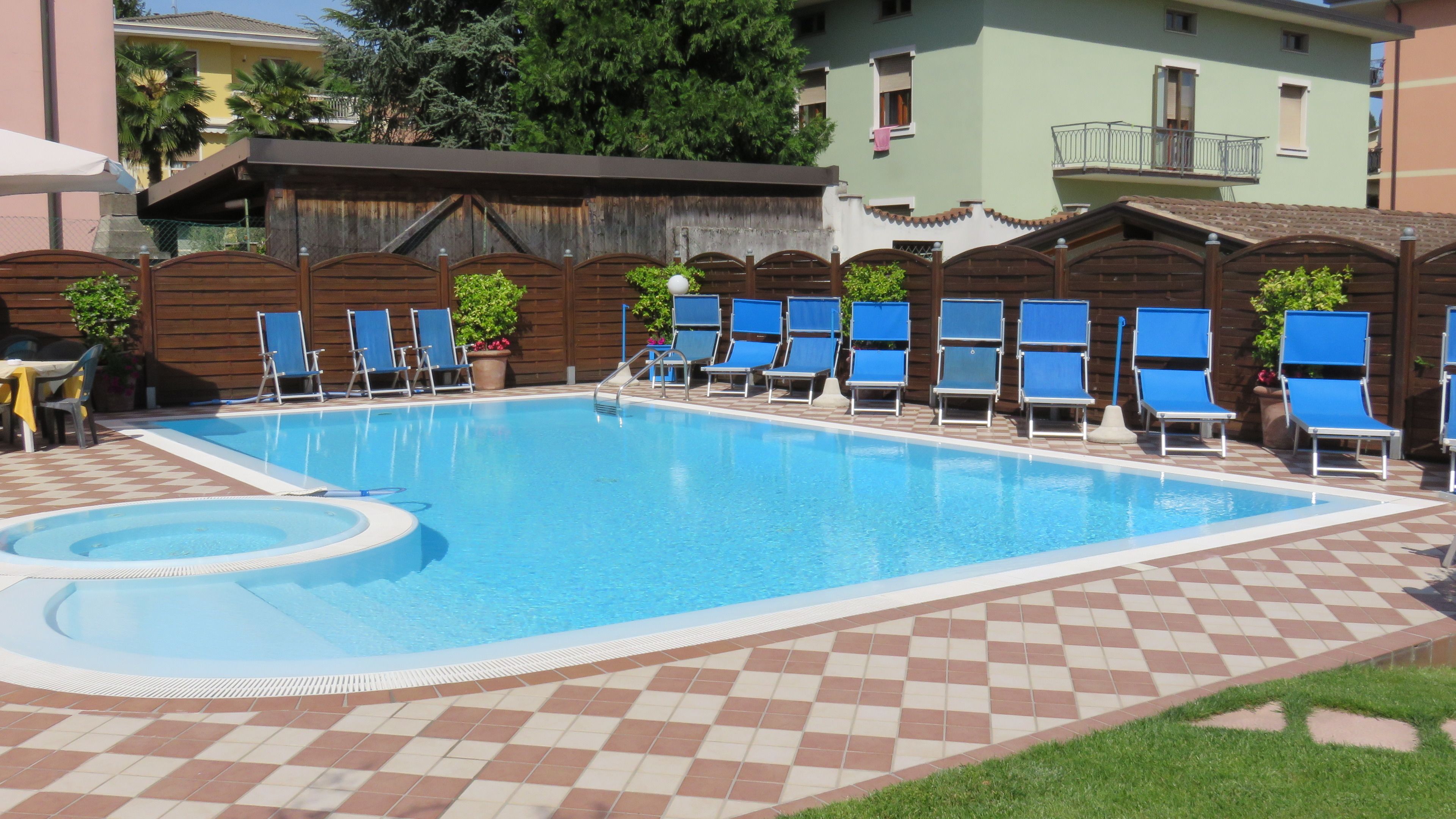 outdoor pool, a rooftop pool, open 8:00 am to 8:00 pm, pool umbrellas
