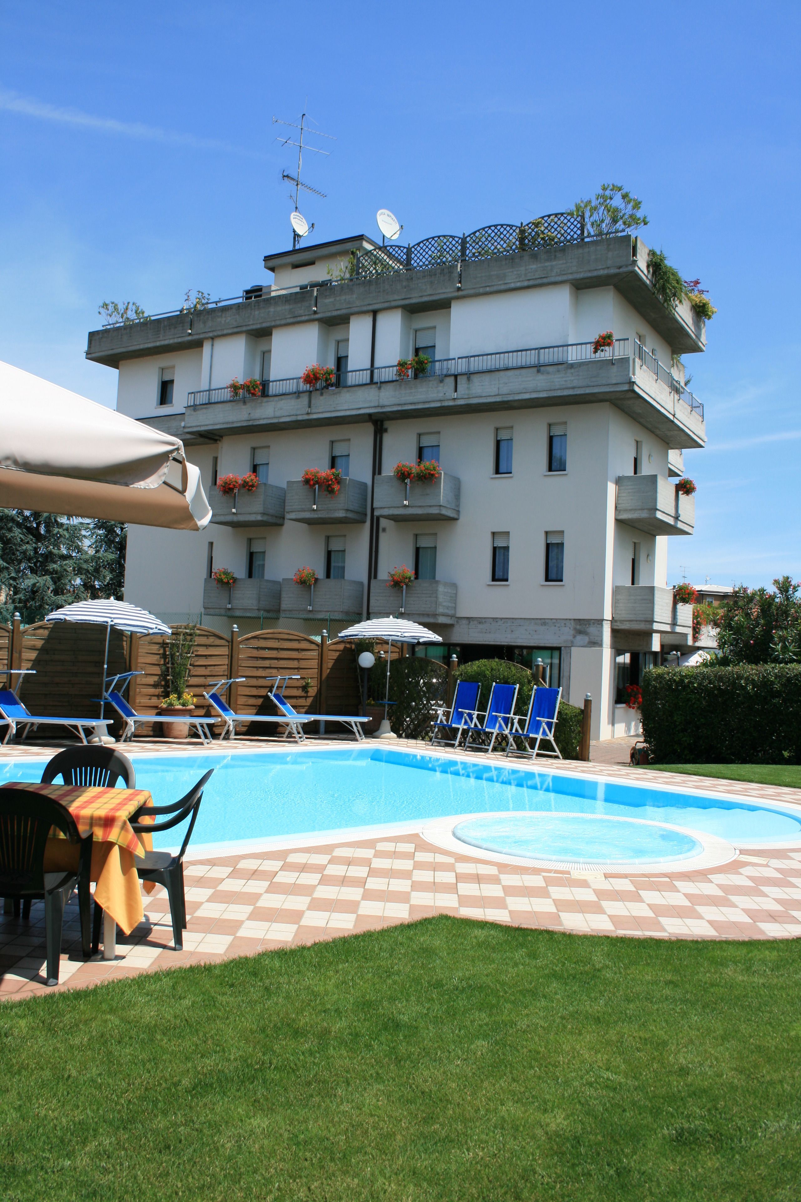 Seasonal outdoor pool, a rooftop pool, pool umbrellas, pool loungers