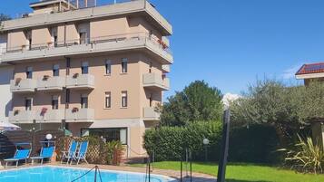 Seasonal outdoor pool, a rooftop pool, pool umbrellas, pool loungers